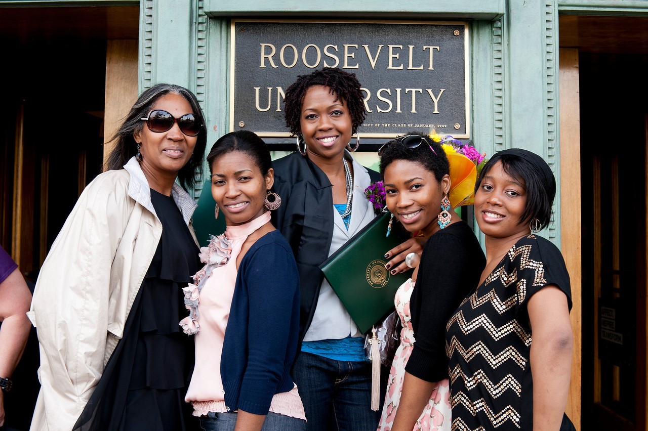 A group of women celebrating graduation form Roosevelt